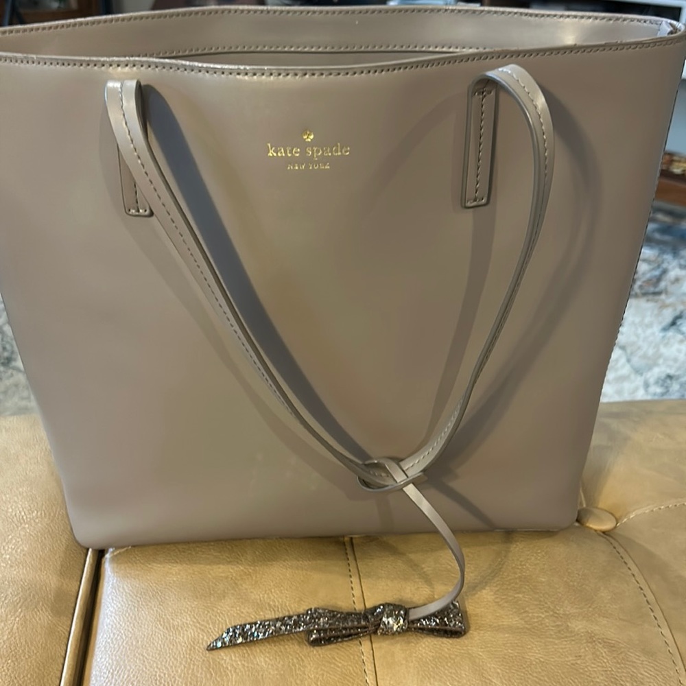 Kate spade large taupe tote with decorative gold glitter bow